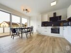 Moderne 3-Zimmer-Wohnung mit großem Balkon und Tiefgaragenstellplatz - Esszimmer und Küche