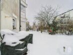Helle Erdgeschosswohnung mit Fußbodenheizung, Terrasse und Tiefgaragenstellplatz - Garten Ansicht 1